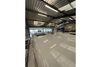 2023 Nimbus 305 Coupe in a showroom, showcasing sleek roof design and modern features.