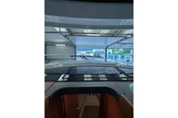 2023 Nimbus 305 Coupe interior view in a boat showroom.
