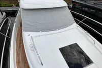 Nimbus 305 Coupe 2023 boat with covered deck and sleek design.