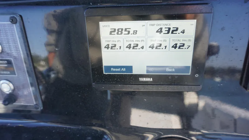  Yacht Photos Pics Yamaha display on 2024 Tidewater 256 CC Adventure showing fuel usage and trip distance.