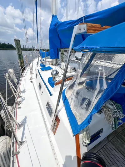 Della Therese Yacht Photos Pics 1986 Tayana Vancouver 42 sailboat with blue covers docked by the water.