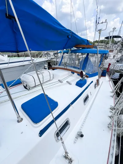 Della Therese Yacht Photos Pics 1986 Tayana Vancouver 42 sailboat with blue covers docked at marina.