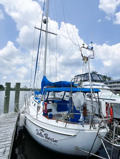 Della Therese Yacht Photos Pics 1986 Tayana Vancouver 42 sailboat docked under a cloudy sky.
