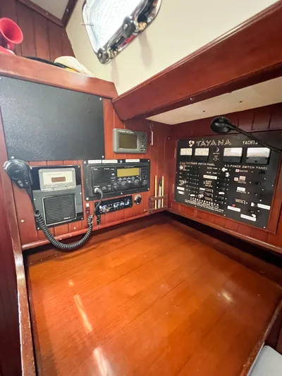 Della Therese Yacht Photos Pics Navigation station of 1986 Tayana Vancouver 42 yacht with control panels and communication equipment.