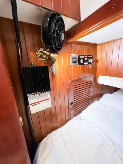 Della Therese Yacht Photos Pics Interior of 1986 Tayana Vancouver 42 yacht cabin with fan, light, and control panel.