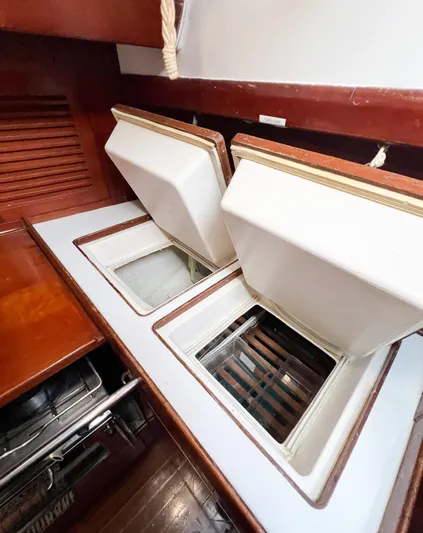 Della Therese Yacht Photos Pics Interior view of 1986 Tayana Vancouver 42 yacht with open storage compartments.