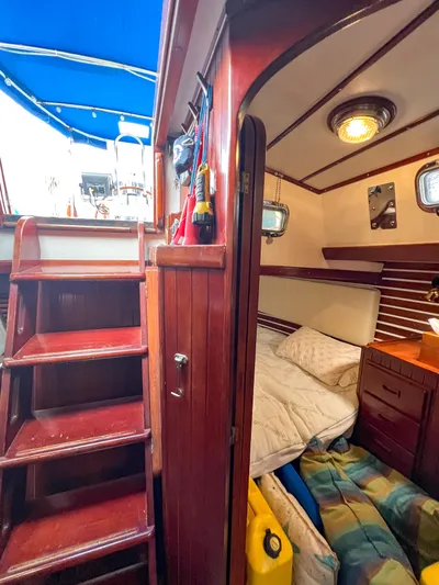 Della Therese Yacht Photos Pics Interior of 1986 Tayana Vancouver 42 sailboat with wooden stairs and cozy cabin.