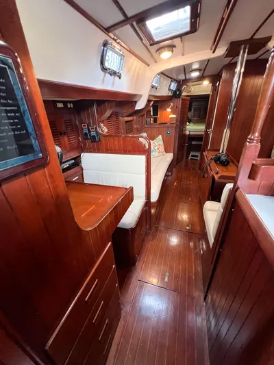 Della Therese Yacht Photos Pics Interior of 1986 Tayana Vancouver 42 yacht with polished wood and cozy seating.