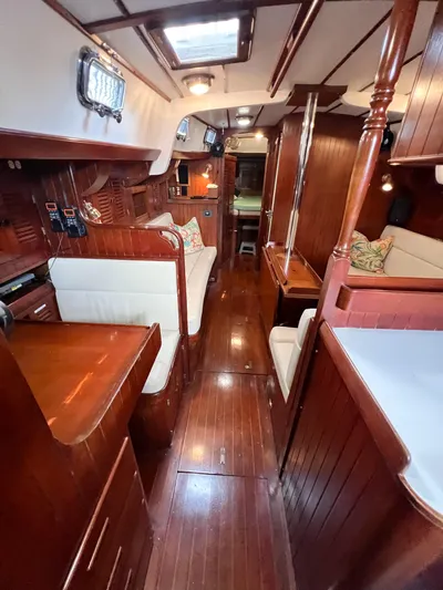 Della Therese Yacht Photos Pics Interior of 1986 Tayana Vancouver 42 yacht with polished wood and cozy seating.