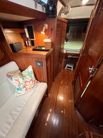 Della Therese Yacht Photos Pics Interior of 1986 Tayana Vancouver 42 yacht with wooden finish and cozy seating area.