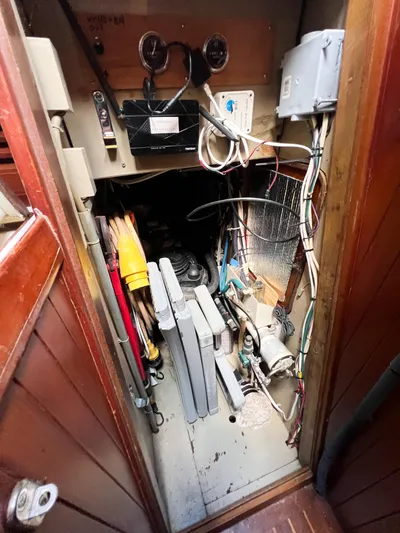 Della Therese Yacht Photos Pics Electrical compartment of a 1986 Tayana Vancouver 42 sailboat, showing wiring and equipment.