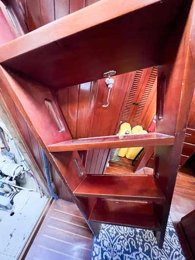 Della Therese Yacht Photos Pics Wooden interior stairs on 1986 Tayana Vancouver 42 sailboat, featuring rich mahogany finish.