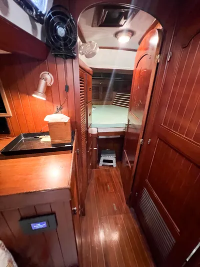 Della Therese Yacht Photos Pics Interior of 1986 Tayana Vancouver 42 sailboat with wooden paneling and cozy cabin space.