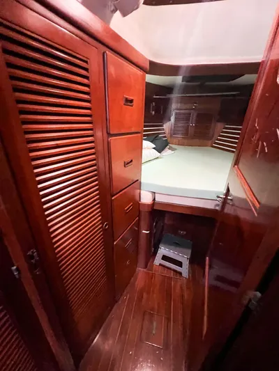 Della Therese Yacht Photos Pics Cozy cabin interior of 1986 Tayana Vancouver 42 sailboat with wooden furnishings.