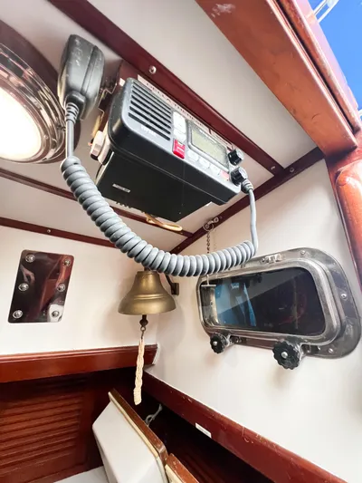 Della Therese Yacht Photos Pics Interior of 1986 Tayana Vancouver 42 yacht with radio, bell, and porthole.