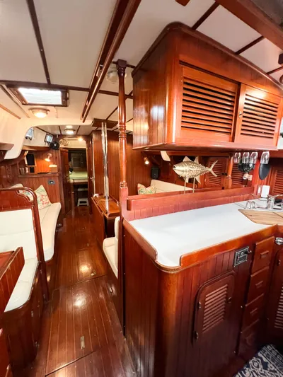 Della Therese Yacht Photos Pics Interior of 1986 Tayana Vancouver 42 sailboat with polished wood and cozy seating.