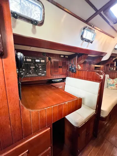 Della Therese Yacht Photos Pics Interior of 1986 Tayana Vancouver 42 sailboat with wooden finish and navigation station.