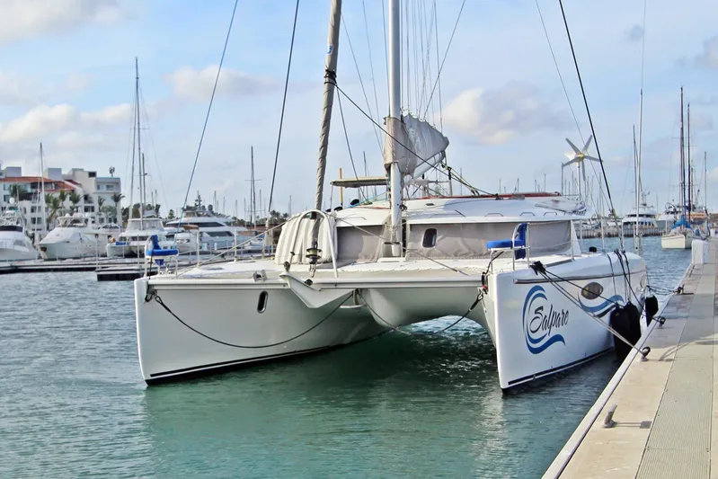  Yacht Photos Pics 2008 Fountaine Pajot Orana 44 catamaran docked at marina, calm waters, clear sky.