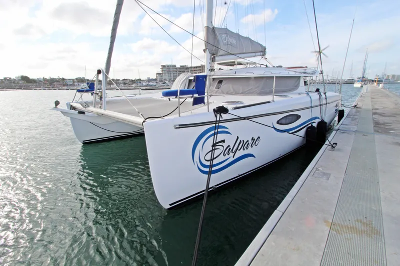  Yacht Photos Pics 2008 Fountaine Pajot Orana 44 catamaran docked at marina, calm waters, clear sky.