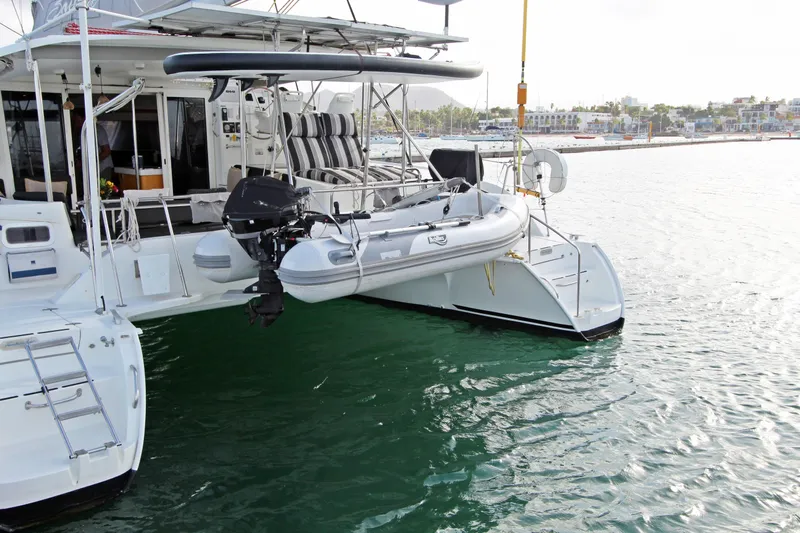  Yacht Photos Pics 2008 Fountaine Pajot Orana 44 catamaran with dinghy, docked in a marina.