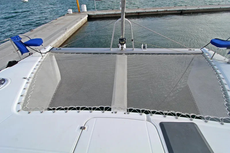  Yacht Photos Pics 2008 Fountaine Pajot Orana 44 catamaran with netting and docked at marina.