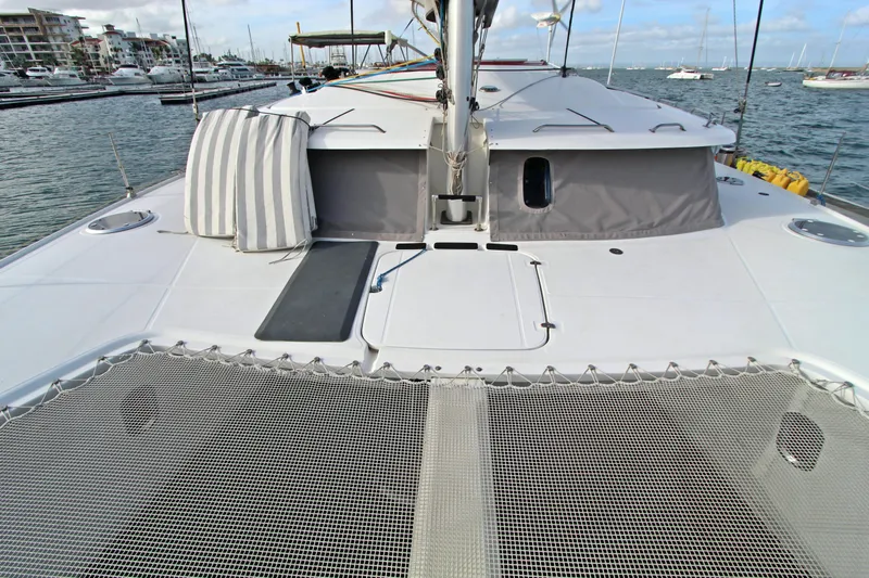  Yacht Photos Pics 2008 Fountaine Pajot Orana 44 catamaran deck with netting and marina view.