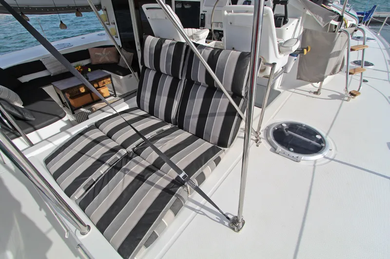  Yacht Photos Pics 2008 Fountaine Pajot Orana 44 catamaran deck with striped cushions and seating area.