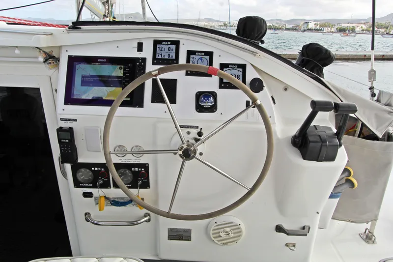  Yacht Photos Pics Helm of 2008 Fountaine Pajot Orana 44 catamaran with navigation instruments and steering wheel.