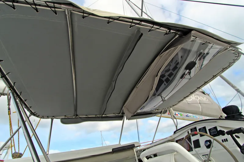  Yacht Photos Pics 2008 Fountaine Pajot Orana 44 catamaran cockpit with protective canopy and steering wheel.