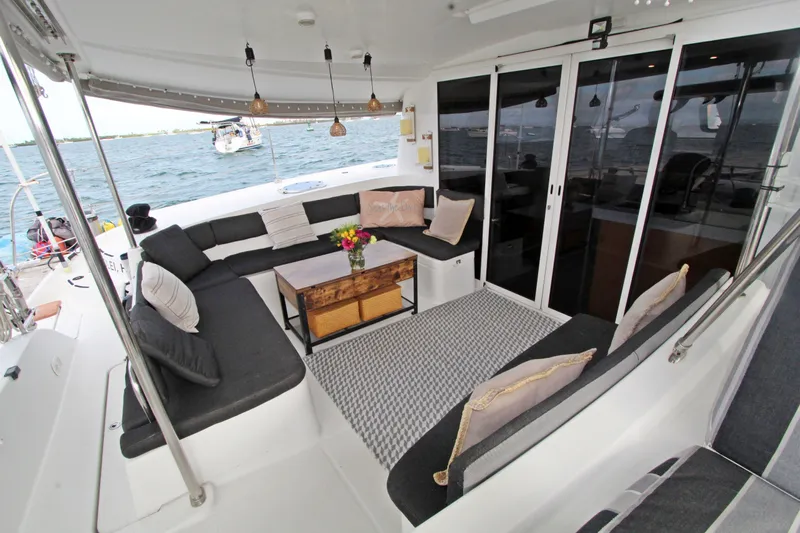  Yacht Photos Pics Luxurious 2008 Fountaine Pajot Orana 44 catamaran with elegant outdoor seating and ocean view.