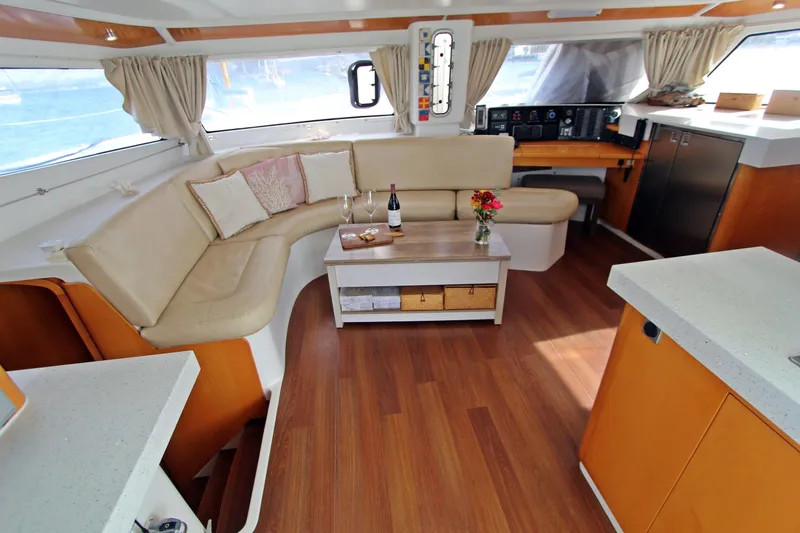  Yacht Photos Pics Luxurious interior of 2008 Fountaine Pajot Orana 44 catamaran with elegant seating and wooden flooring.