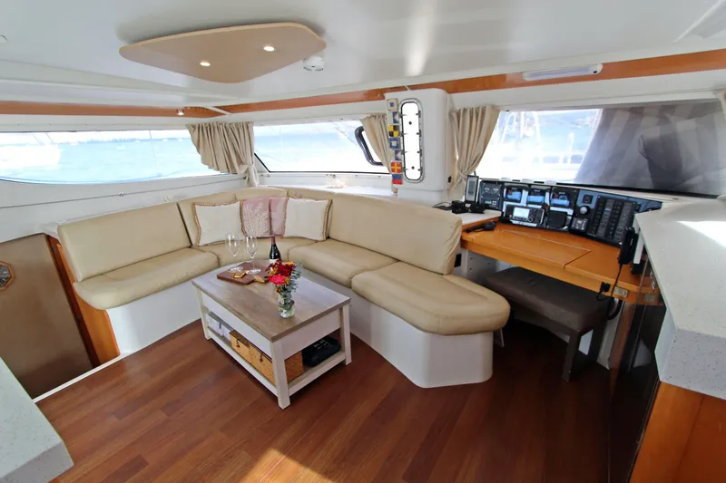  Yacht Photos Pics Luxurious interior of 2008 Fountaine Pajot Orana 44 catamaran with elegant seating and navigation area.