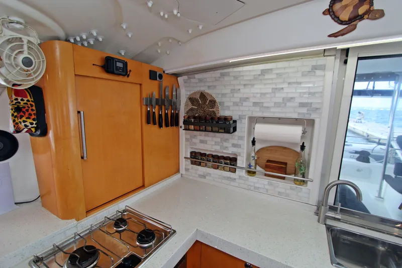  Yacht Photos Pics Modern kitchen in 2008 Fountaine Pajot Orana 44 catamaran with stove, knives, and spice rack.
