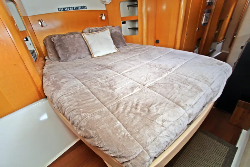  Yacht Photos Pics Luxurious bedroom interior of 2008 Fountaine Pajot Orana 44 catamaran with cozy bedding.