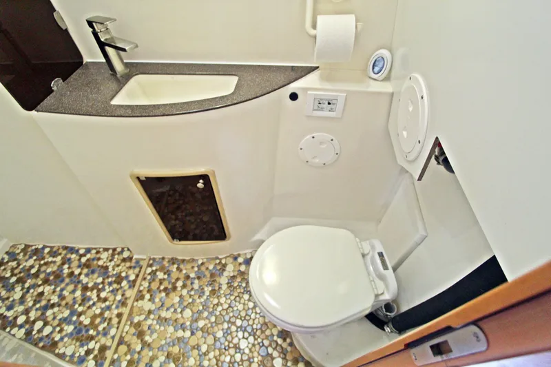  Yacht Photos Pics Bathroom interior of 2008 Fountaine Pajot Orana 44 catamaran with mosaic floor tiles.