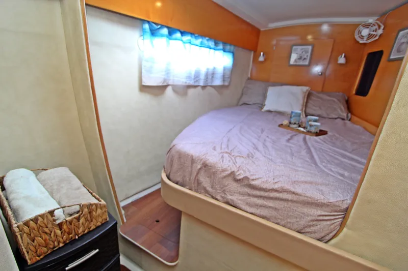  Yacht Photos Pics Cozy bedroom in 2008 Fountaine Pajot Orana 44 catamaran with soft lighting and decor.