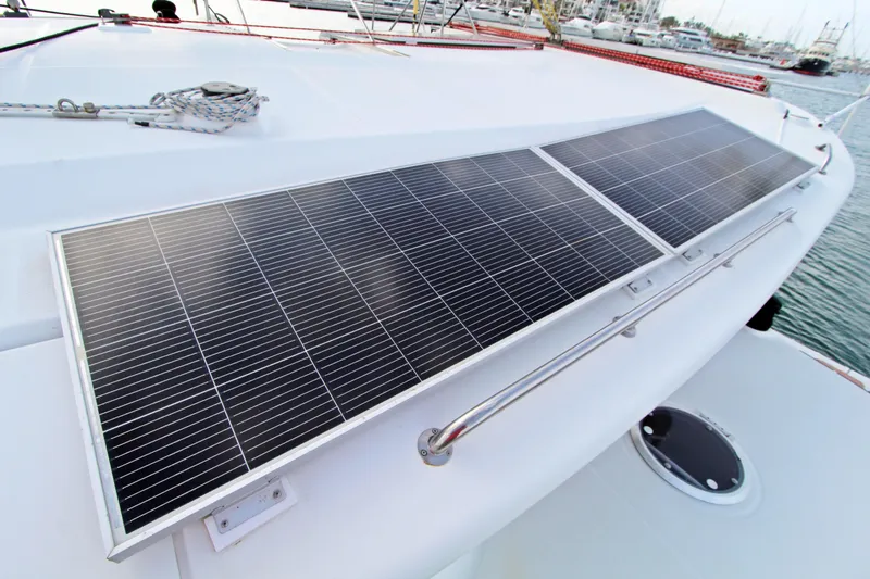  Yacht Photos Pics Solar panels on 2008 Fountaine Pajot Orana 44 catamaran deck in marina setting.