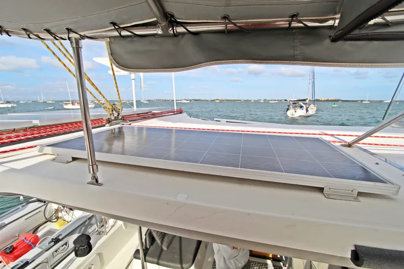  Yacht Photos Pics 2008 Fountaine Pajot Orana 44 catamaran with solar panel on deck, anchored in scenic bay.