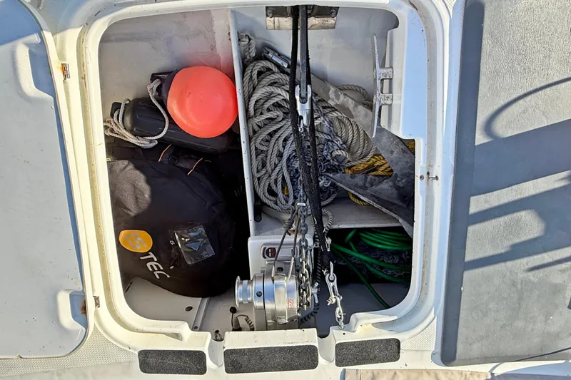  Yacht Photos Pics Storage compartment on a 2008 Fountaine Pajot Orana 44, containing ropes and equipment.