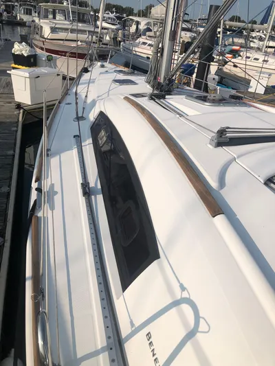 Superstition Yacht Photos Pics 2012 Beneteau Oceanis 40 sailboat docked at marina, showcasing sleek deck design.