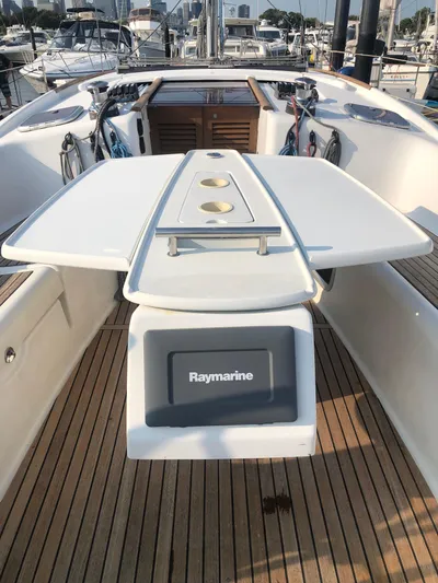 Superstition Yacht Photos Pics 2012 Beneteau Oceanis 40 yacht cockpit with Raymarine navigation system and wooden deck.