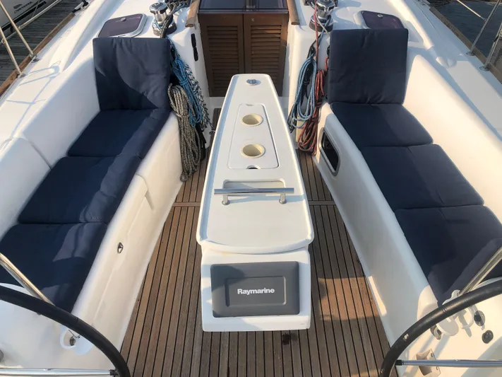 Superstition Yacht Photos Pics Beneteau Oceanis 40 cockpit, 2012 model, featuring cushioned seating and teak flooring.