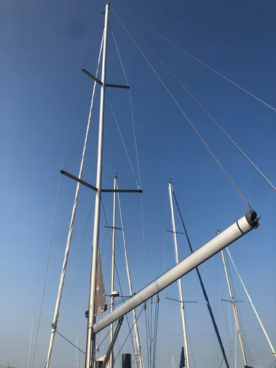 Superstition Yacht Photos Pics Mast of 2012 Beneteau Oceanis 40 sailboat against clear blue sky.