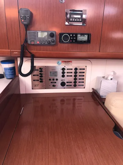 Superstition Yacht Photos Pics Control panel and radio equipment inside a 2012 Beneteau Oceanis 40 sailboat cabin.