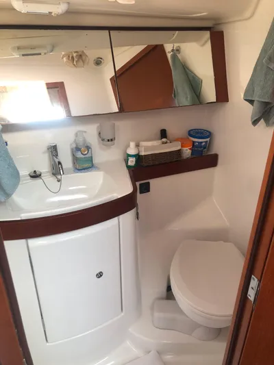 Superstition Yacht Photos Pics Bathroom interior of 2012 Beneteau Oceanis 40 yacht, featuring sink and toilet.