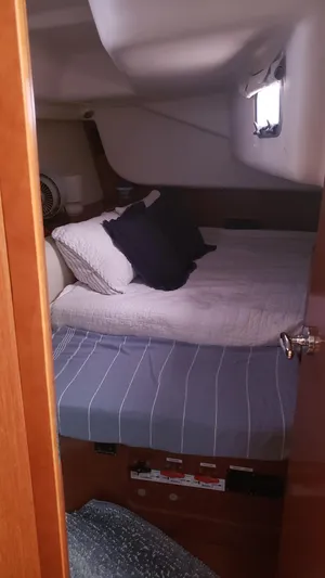 Superstition Yacht Photos Pics Cozy cabin interior of 2012 Beneteau Oceanis 40 sailboat with bed and window.