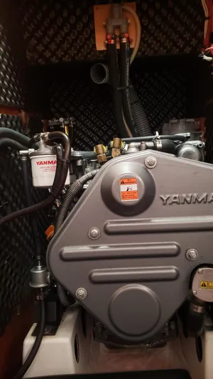 Superstition Yacht Photos Pics Yanmar engine in a 2012 Beneteau Oceanis 40 sailboat, showcasing mechanical components.
