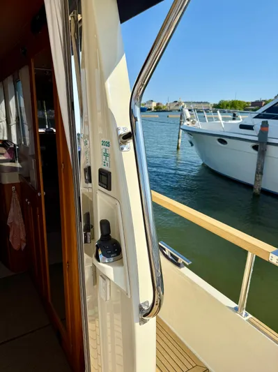  Yacht Photos Pics 2016 Targa 44 yacht interior with view of marina and docked boats.