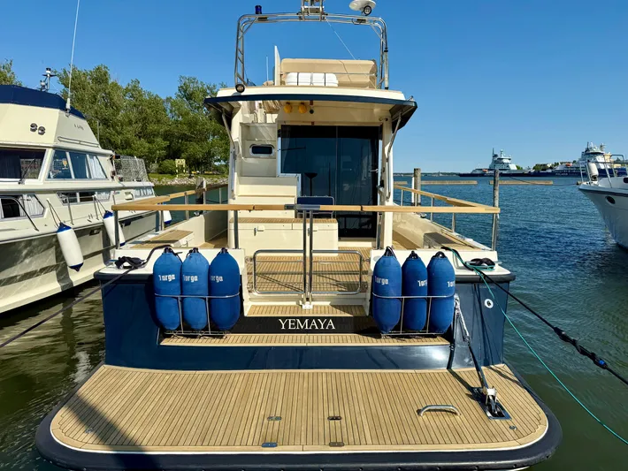  Yacht Photos Pics Targa 44 yacht docked, rear view, with blue fenders, sunny day, 2016 model.