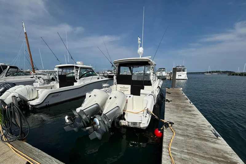  Yacht Photos Pics 2020 Boston Whaler 325 Conquest Pilothouse docked at marina.